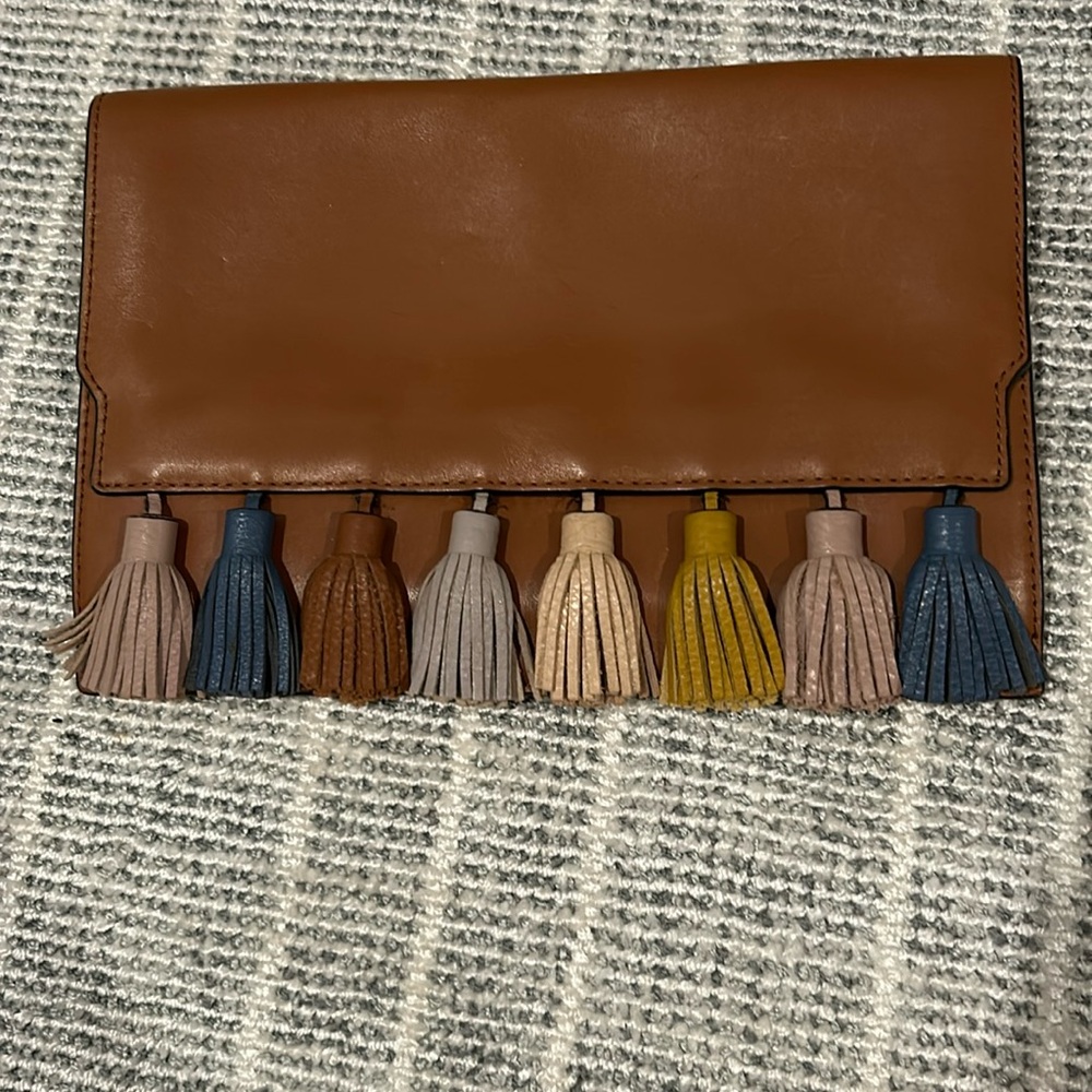 Rebeca mink-off tassel clutch